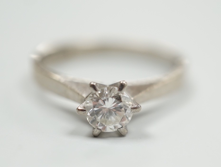 A modern Swedish 18k white metal and solitaire diamond set ring, size K, gross weight 2.6 grams
